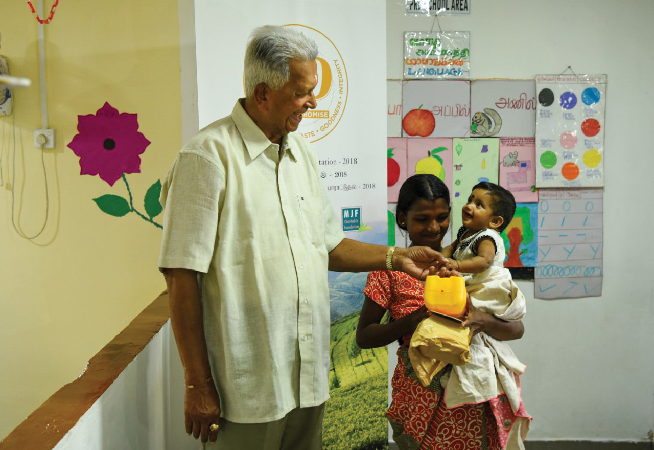 Founder Merrill J Fernando with at a Dilmah Child Development Centre, kindness